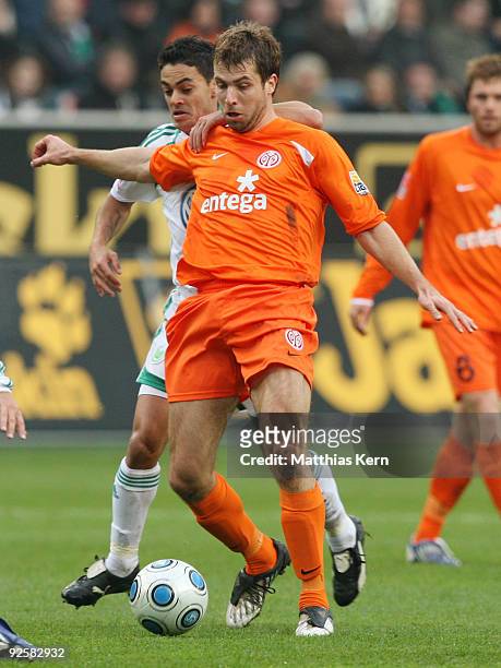 Andreas Ivanschitz of Mainz battles for the ball with Josue of Wolfsburg during the Bundesliga match between VFL Wolfsburg and FSV Mainz 05 at the...