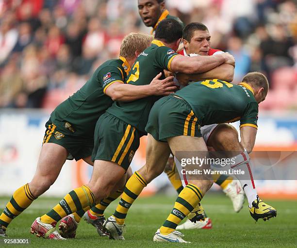 Ryan Hall of England is tackled by a group of Australian players during the Gillette Four Nations match between England and Australia at DW Stadium...