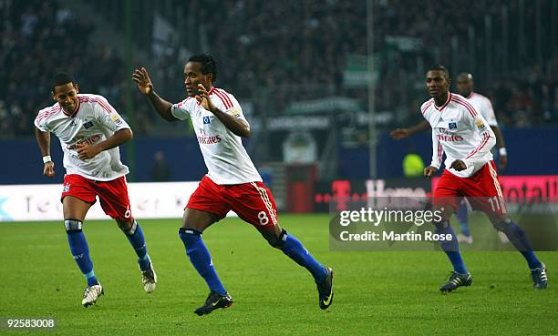 Ze Roberto of Hamburg celebrates after scoring his team's 2nd goal during the Bundesliga match between Hamburger SV and Borussia M'gladbach at the...
