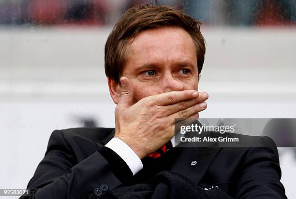 Manager Horst Heldt of Stuttgart wipes his face before the Bundesliga match between VfB Stuttgart and Bayern Muenchen at the Mercedes-Benz Arena on...