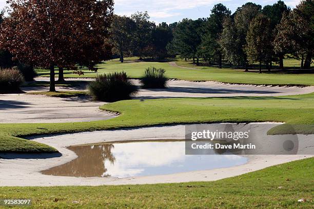 Water stands in the traps as well as puddling in the fairway and at the 16th green as PGA Tour officials attempt to determine when first round play...