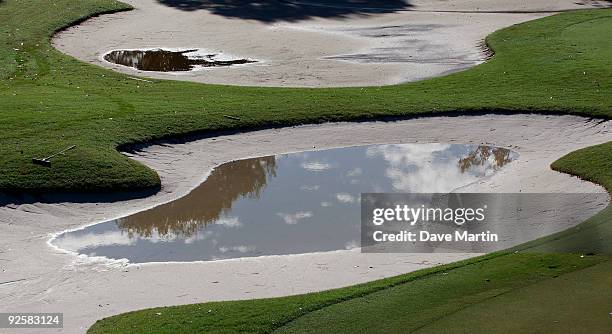 Water stands in the traps as well as puddling in the fairway and at the 16th green as PGA Tour officials attempt to determine when first round play...