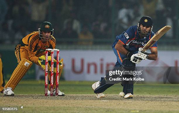 Yuvraj Singh of India pushes the ball for a single during the third One Day International match between India and Australia at Feroz Shah Kotla on...