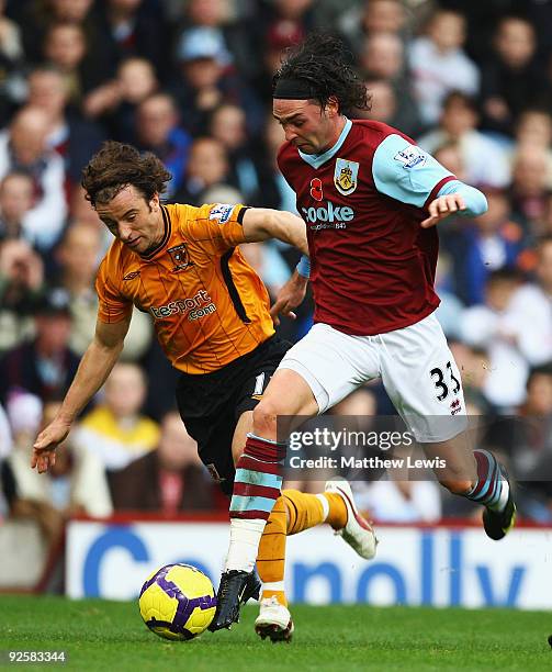 Stephen Hunt of Hull City and Chris Eagles of Burnley challenge for the ball during the Barclays Premier League match between Burnley and Hull City...