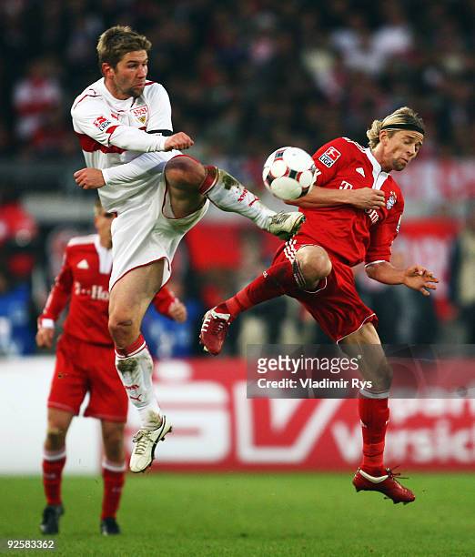Thomas Hitzlsperger of Stuttgart and Anatoliy Tymoshchuk of Bayern battle for the ball during the Bundesliga match between VfB Stuttgart and FC...