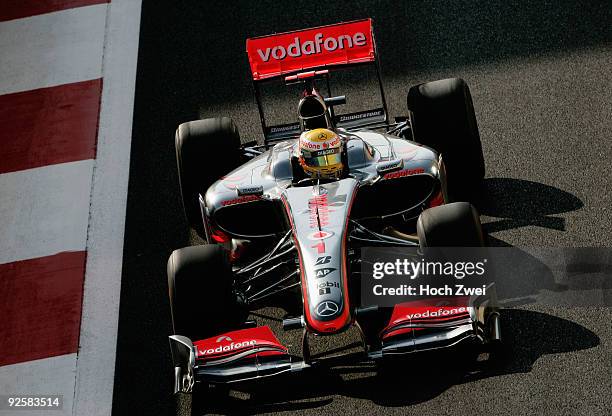 Lewis Hamilton of Great Britain and McLaren Mercedes drives on his way to taking pole position during qualifying for the Abu Dhabi Formula One Grand...