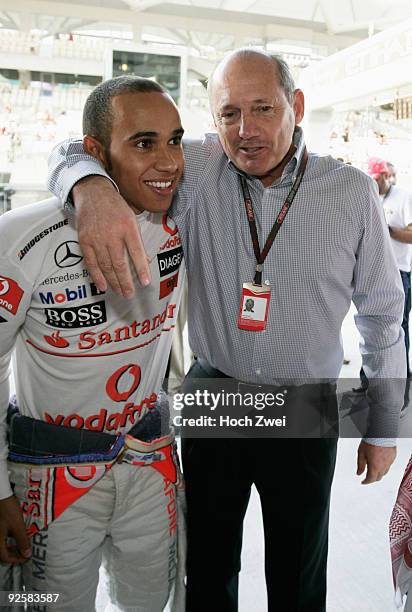 Lewis Hamilton of Great Britain and McLaren Mercedes celebrates with Ron Dennis, executive chairman of McLaren Automotive, after taking pole position...