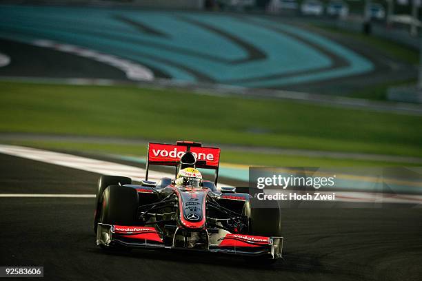 Lewis Hamilton of Great Britain and McLaren Mercedes drives on his way to taking pole position during qualifying for the Abu Dhabi Formula One Grand...