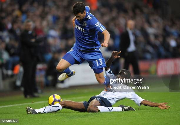 Micheal Ballack of Chelsea is Tacked by Fabrice Muamba of Bolton during the Barclays Premier League match between Bolton and Chelsea at the Reebok...