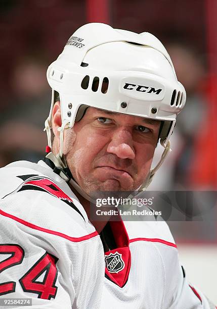 Scott Walker of the Carolina Hurricanes pauses for a stretch during warmups prior to his game against the Philadelphia Flyers on October 31, 2009 at...