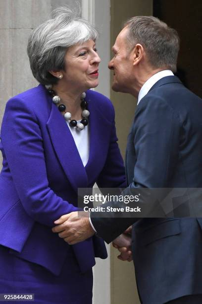 Prime Minister Theresa May greets European Council President Donald Tusk at 10 Downing Street March 1, 2018 in London.