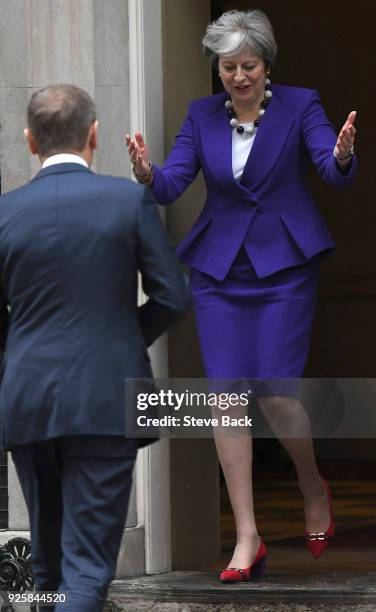 Prime Minister Theresa May greets European Council President Donald Tusk at 10 Downing Street March 1, 2018 in London.