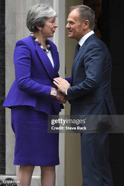 Prime Minister Theresa May greets European Council President Donald Tusk at 10 Downing Street March 1, 2018 in London.