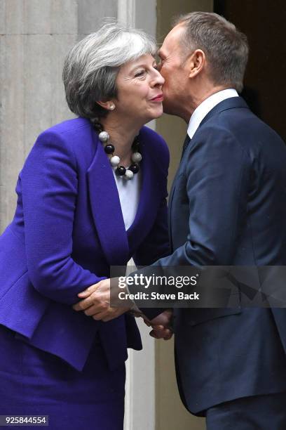 Prime Minister Theresa May greets European Council President Donald Tusk at 10 Downing Street March 1, 2018 in London.