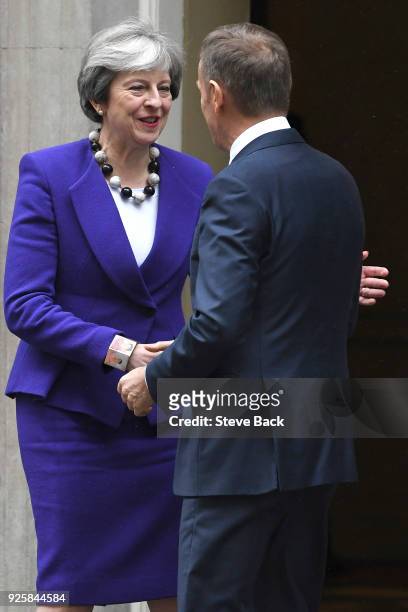 Prime Minister Theresa May greets European Council President Donald Tusk at 10 Downing Street March 1, 2018 in London.
