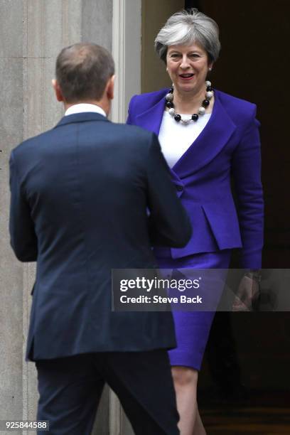 Prime Minister Theresa May greets European Council President Donald Tusk at 10 Downing Street March 1, 2018 in London.