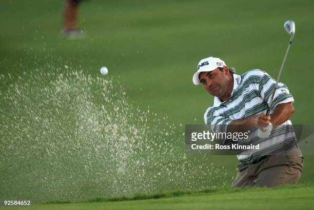 Angel Cabrera of Argentina hits out of a bunker to the 18th green on the second play off hole during the Semi Finals of the Volvo World Match Play...