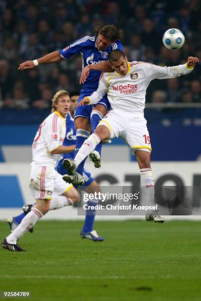 Marcelo Bordon of Schalke and Eren Derdiyok of Leverkusen go up for a header during the Bundesliga match between FC Schalke 04 and Bayer Leverkusen...