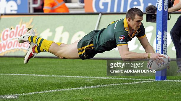 Australia's Wing Brett Morris dives over to score their fifth try during the Gillette Four Nations International Rugby League match between England...