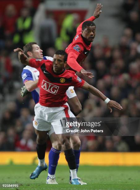 Nani and Patrice Evra of Manchester United clashes with Brett Emerton of Blackburn Rovers during the FA Barclays Premier League match between...