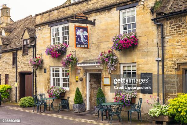 the angel pub in cotswold village of burford - rural england stock pictures, royalty-free photos & images