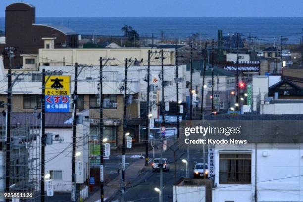 The streets of downtown Tomioka, Fukushima Prefecture, remain deserted in January 2018, almost seven years after radioactive contamination from the...