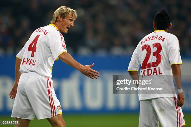 Sami Hyypiae of Leverkusen issues instructions to Arturo Vidal during the Bundesliga match between FC Schalke 04 and Bayer Leverkusen at the Veltins...