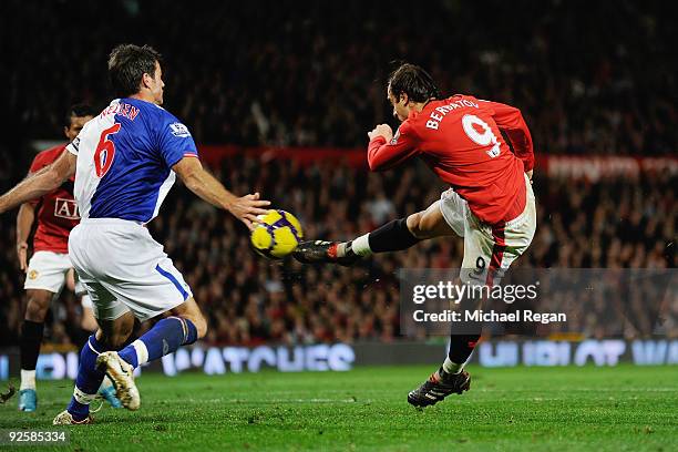 Dimitar Berbatov of Manchester United scores the first goal during the Barclays Premier League match between Manchester United and Blackburn Rovers...