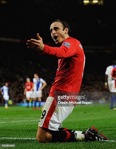 Dimitar Berbatov of Manchester United celebrates scoring the first goal during the Barclays Premier League match between Manchester United and...