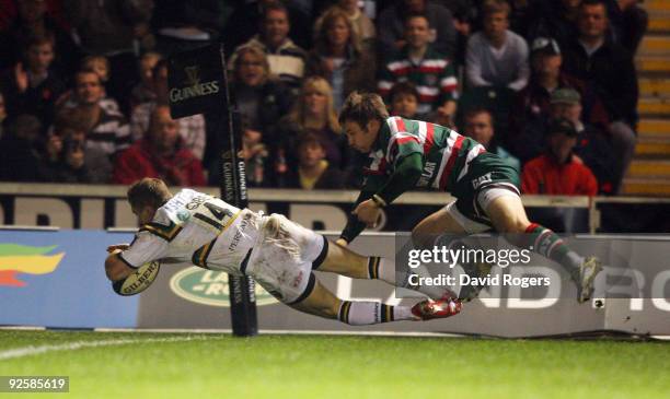 Chris Ashton of Northampton dives over to score a try during the Guinness Premiership match between Leicester Tigers and Northampton Saints at...