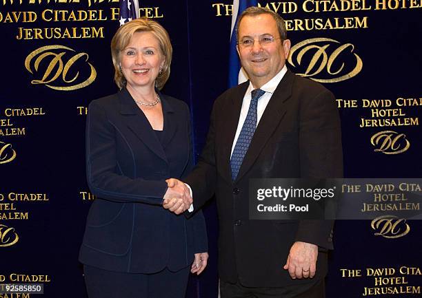 Secretary of State Hillary Clinton shakes hands with Israel's Defence Minister Ehud Barak before their meeting October 31, 2009 in Jerusalem, Israel....