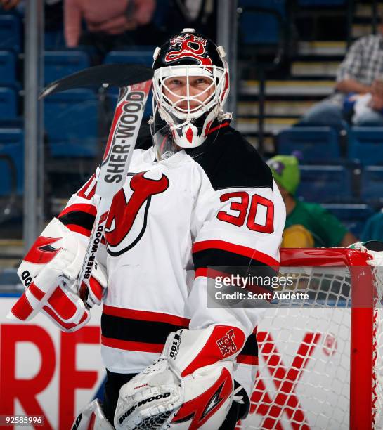 Goaltender Martin Brodeur of the New Jersey Devils adjust his stick during a break in the action against the Tampa Bay Lightning at the St. Pete...