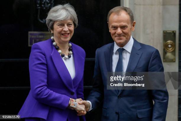 Theresa May, U.K. Prime minister, left, greets Donald Tusk, president of the European Union , outside number 10 Downing Street in London, U.K., on...