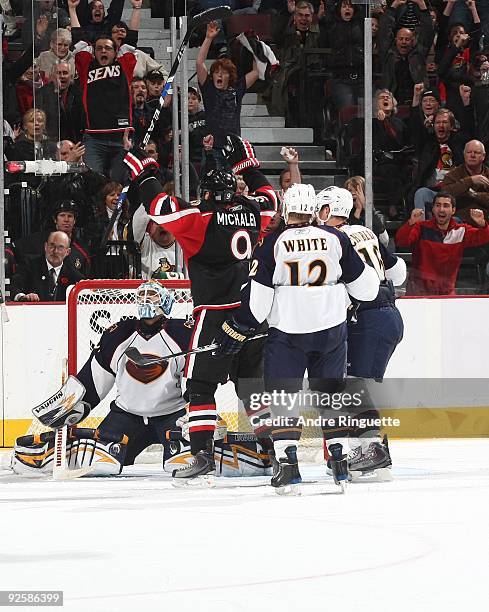 Milan Michalek of the Ottawa Senators celebrates a power play goal against Ondrej Pavelec, Todd White and Christoph Schubert of the Atlanta Thrashers...