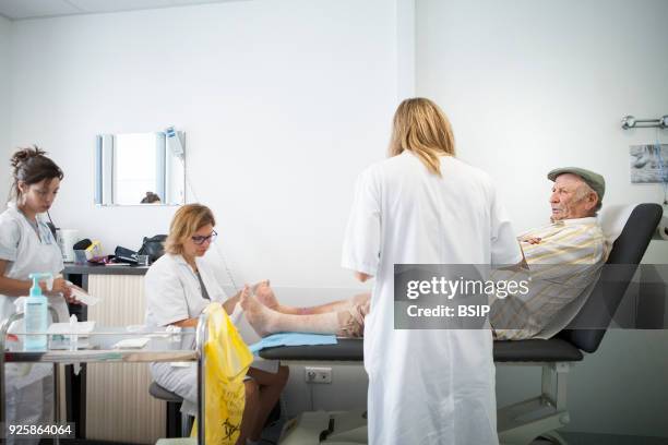 Diabetic feet consultations, Savoie, France, specialized team devoted to treatment and after-care for diabetic patients foot lesions. The nurse talks...