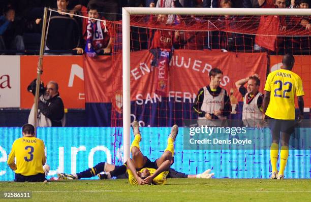 Eric Abidal of Barcelona looks dejected after Osasuna scored the equalizing goal during the La Liga match between Barcelona and Osasuna at Estadio...