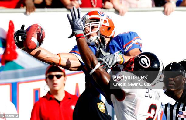 Riley Cooper of the Florida Gators pulls in a touchdown reception against Brandon Boykin of the Georgia Bulldogs at Jacksonville Municipal Stadium on...