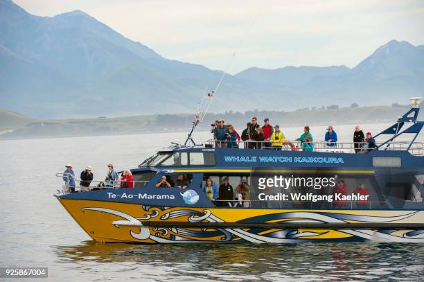 Tourists on a whale watching boat off the coast of Kaikoura on the South Island in New Zealand.