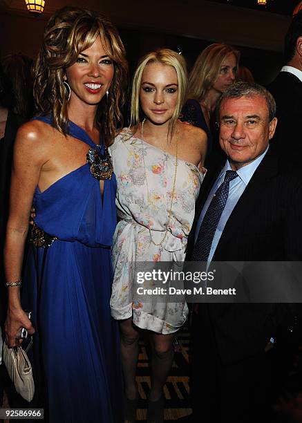 Sol Kerzner and actress Lindsay Lohan with Heather Kerzner attends the grand opening night of the Kerzner Mazagan Beach Resort on October 31, 2009 in...