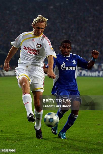 Sami Hyypiae of Leverkusen is challenged by Jefferson Farfan of Schalke during the Bundesliga match between FC Schalke 04 and Bayer 04 Leverkusen at...