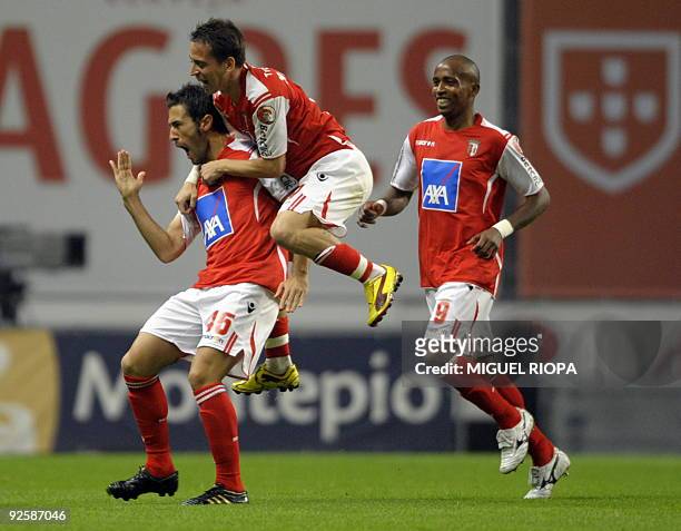 Braga's Hugo Viana celebrates with his teamates after scoring against SL Benfica during their Portuguese league football match at the AXA Stadium in...