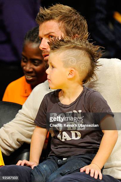 David Beckham and his son Cruz with a tomahawk haircut follow the action between the Los Angeles Lakers and the Dallas Mavericks at Staples Center on...