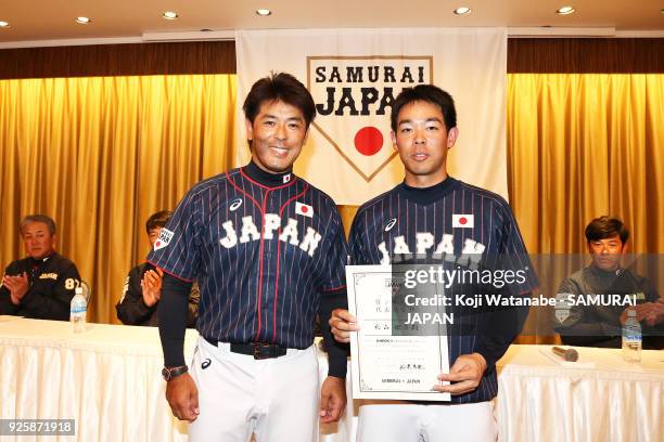 Japan Manager Atsunori Inaba and Shogo Akiyama meeting during a Japan training session at the Nagoya Dome on March 1, 2018 in Nagoya, Aichi, Japan.