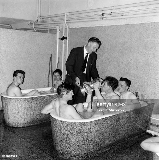 Tottenham Hotspur Double Winnkng Season 1960 A Spurs player drinks from the FA Cup trophy as he sits in the bath following their victory over...