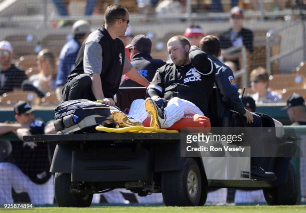 Jake Burger of the Chicago White Sox is carted off the field after suffering an injury to his left achilles tendon during the game against the...