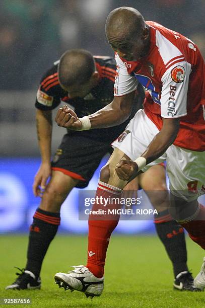 Braga´s Paulo Cesar from Brazil celebrates close to Benfica´s player Maxi Pereira from Uruguay after scoring during their Portuguese league football...