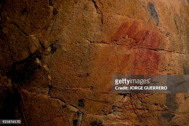 Picture shows neanderthal cave-paintings inside the Andalusian cave of Ardales, on March 1, 2018. The cave-paintings found in three caves in Spain,...