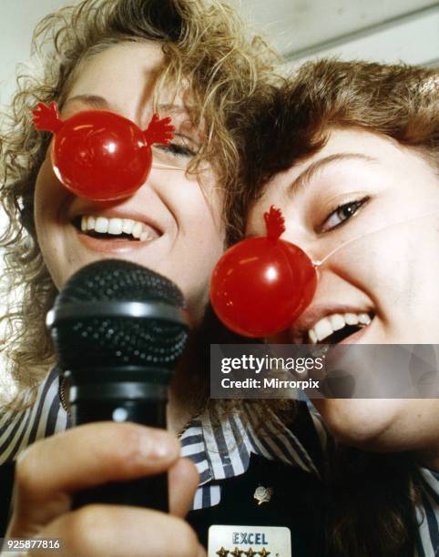 Woolworth's shop assistants, Melanie Wass and Angela Woodcock, pictured trying out their vocal talents in a karaoke session at the Darlington shop to...