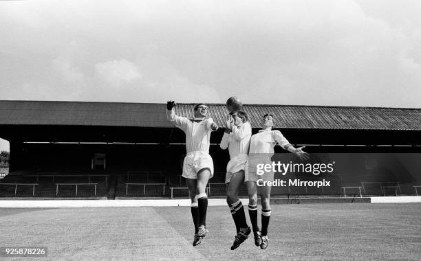 Charlton Athletic team training session at the Valley. Billy Bonds jumping up for the ball with Cliff Myers and Ray Keeley. August 1964.