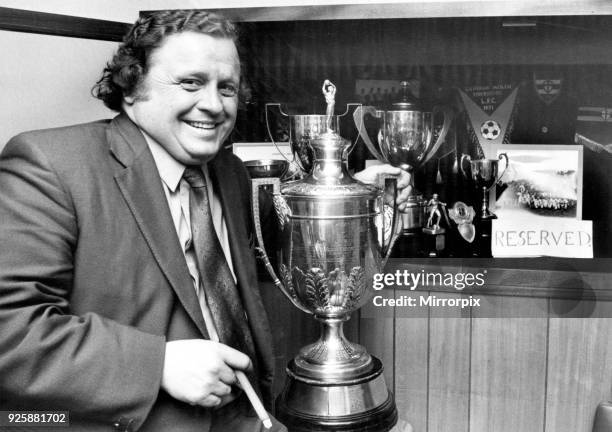 Past Alvechurch glories are reflected in the Lye Meadow trophy cupboard as Chairman Don Pedley nurses the Worcestershire Senior Cup. Future dreams...